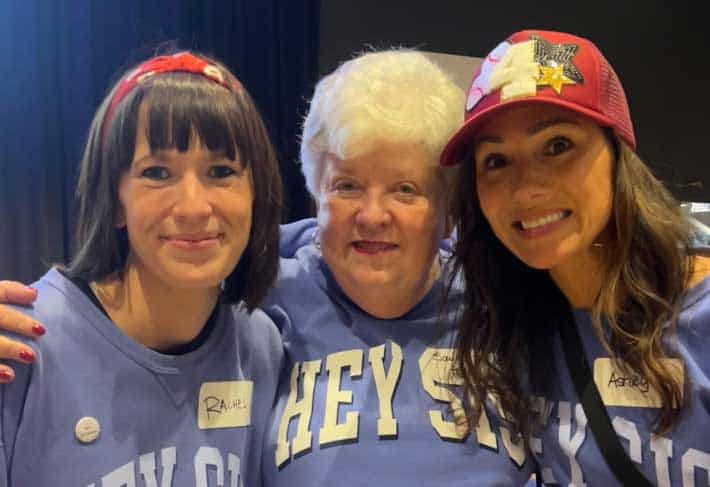 Group of smiling women volunteers at Rolling Hills Community Church event.