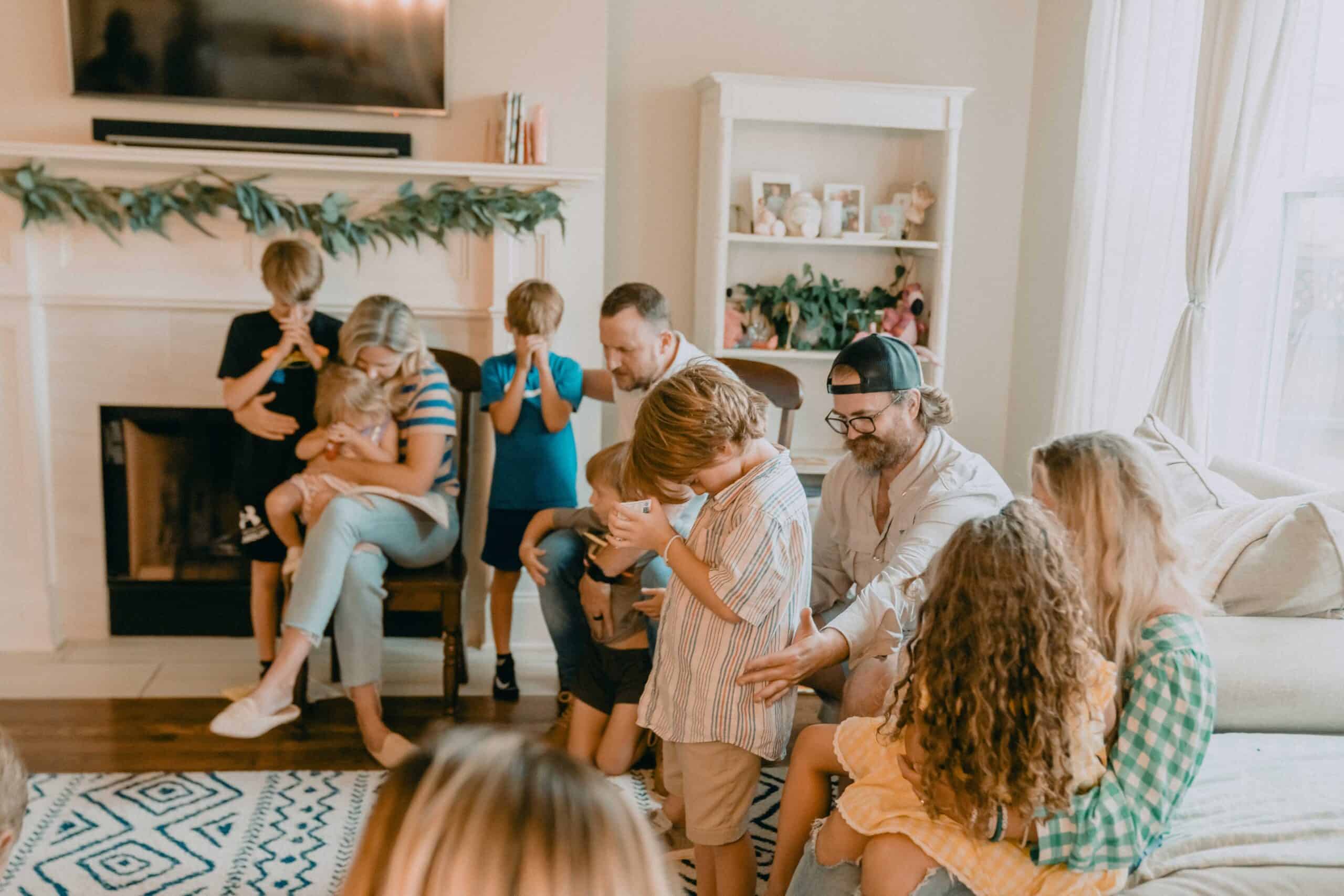 Family and children participating in a church community event at home.