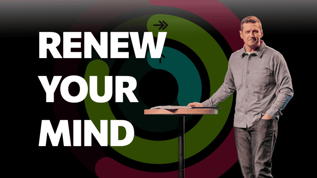 Man speaking at a church event with "Renew Your Mind" message, community faith, spiritual growth.