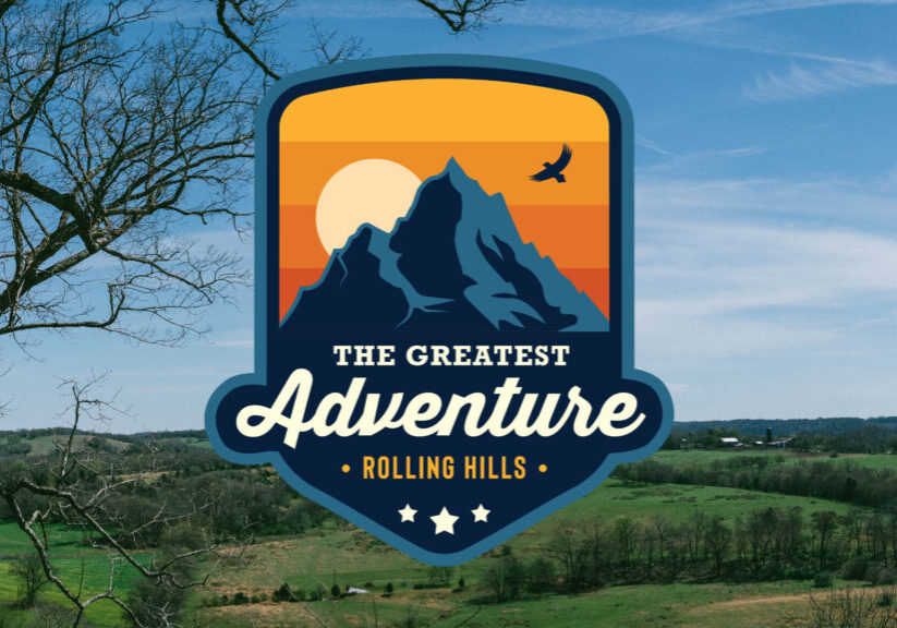 Logo of Rolling Hills Community Church with mountain and sunset design.