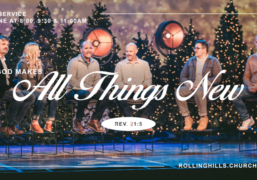 Group of people on stage during Christmas service at Rolling Hills Church with decorated trees.