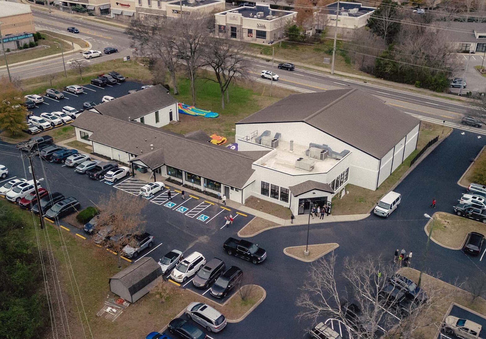 Exterior view of Rolling Hills Community Church with parking lot and surrounding area.
