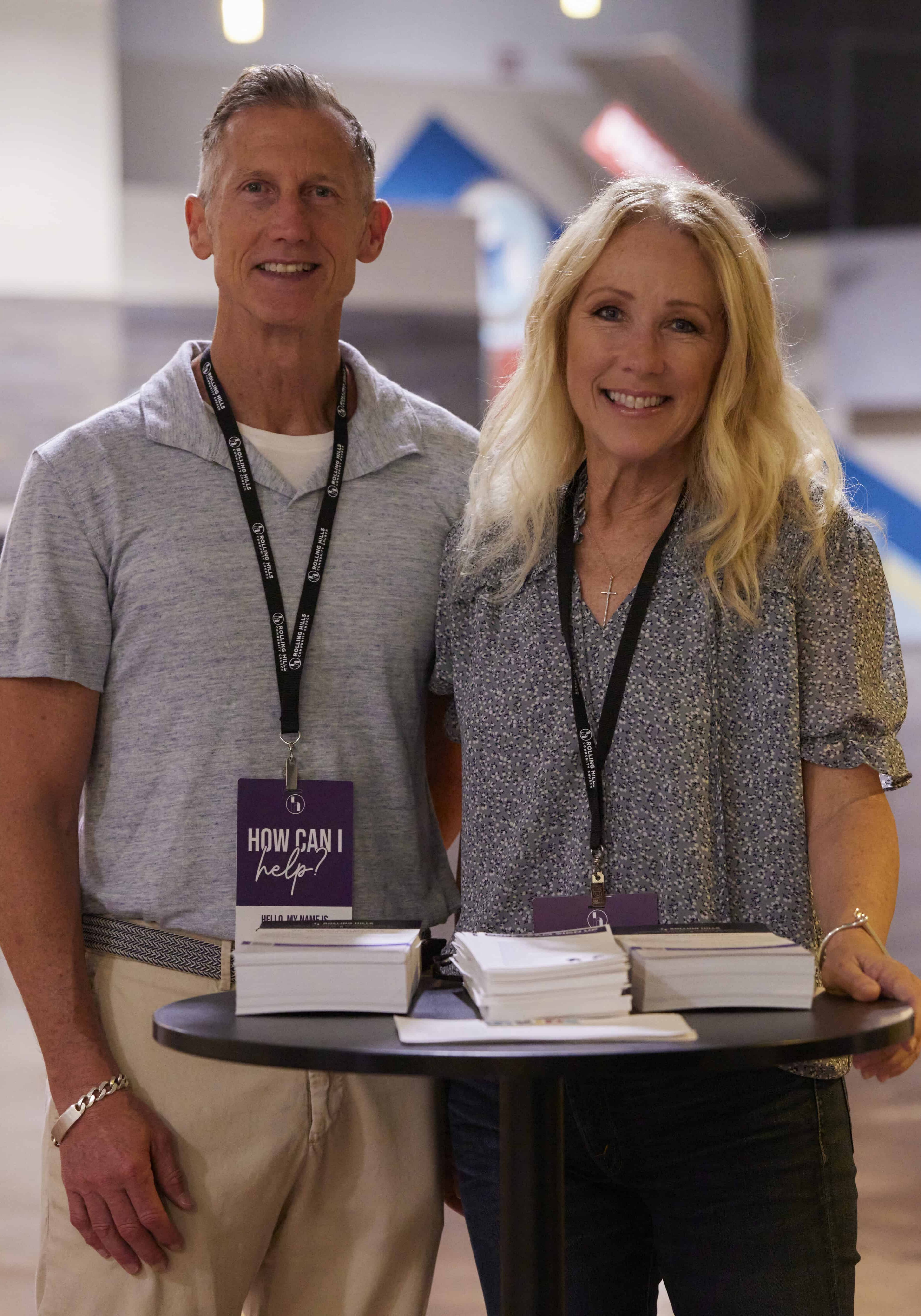 Two smiling community leaders at Rolling Hills Community Church conference.