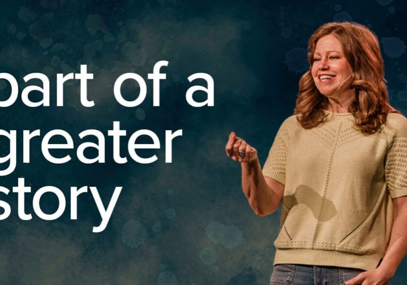 Woman smiling and speaking at a church event, representing community and faith.