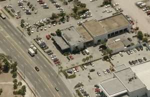Aerial view of Romano Law Group office with parking lot and surrounding streets.