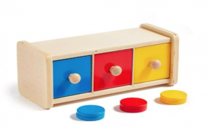 Colorful wooden toy with three drawers and coins for children.