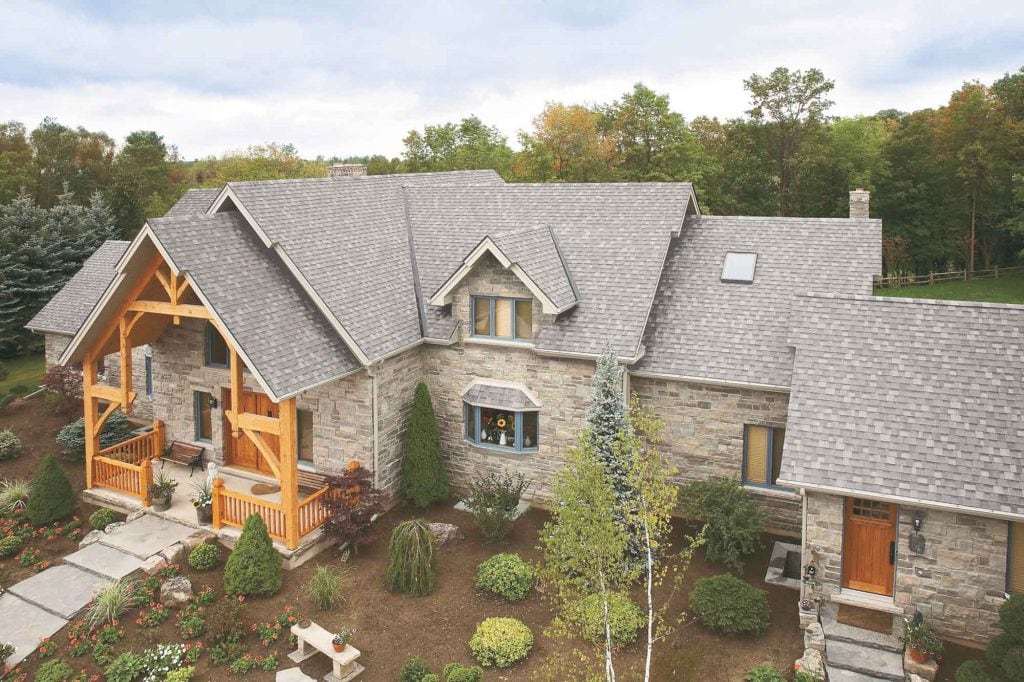 Roofing Utah - Expert roofing installation on a luxurious stone and wood home in Utah. Quality craft.