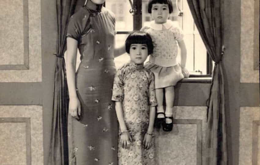 A Taishan woman with her daughters in the 1930s, showcasing family bonds and cultural heritage.