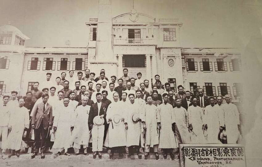 A formal group photo of the Wuyi diaspora in Vancouver, highlighting their community spirit and cultural identity.