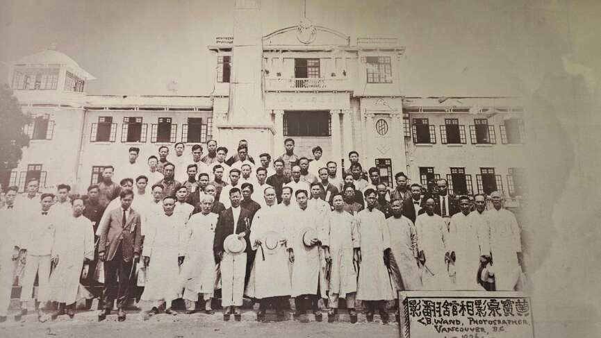 A formal group photo of the Wuyi diaspora in Vancouver, highlighting their community spirit and cultural identity.