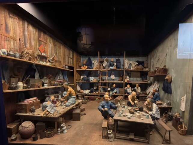 Historical photograph showing Heshan migrants in Singapore during the early 20th century, with traditional Chinese architecture in the background