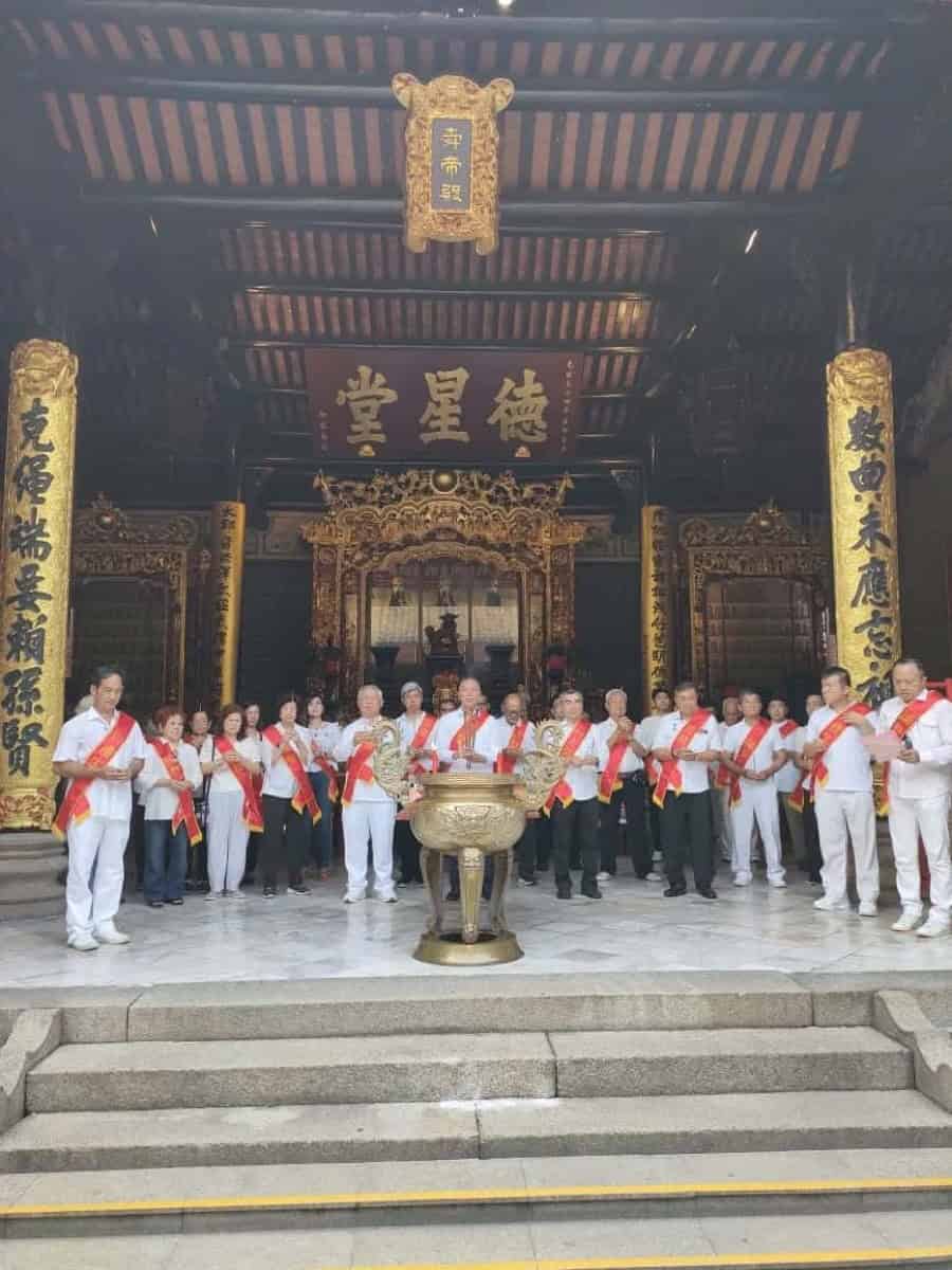 Traditional Chinese ancestral hall with carved pillars and ancestor tablets, representing the physical center of Cao clan identity in rural Taishan