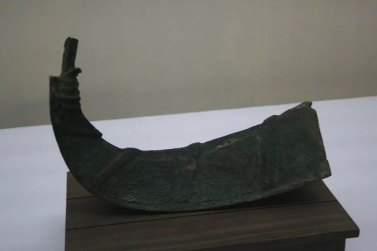 Western Zhou dynasty bronze ritual wine vessel photographed with Canon EOS 400D at museum, representing the era of Xie surname origin during the Zhou dynasty