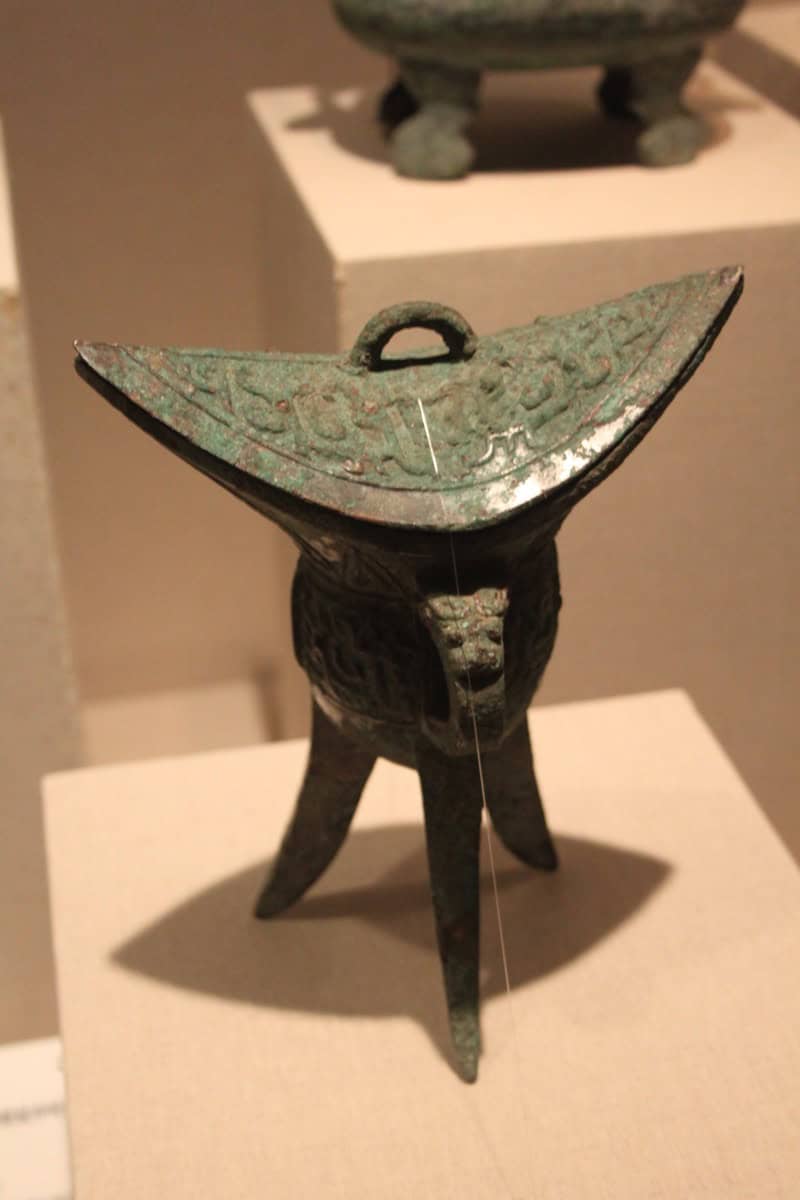 A Western Zhou Dynasty bronze ritual wine vessel (jiao), photographed with a Canon EOS 500D — one of the refined ceremonial bronzes that defined Zhou material culture.