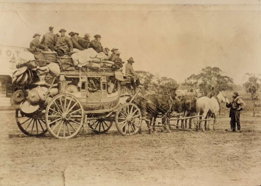 Cantonese miners panning for gold during the Australian gold rush, a group of Chinese men working a creek bed with mining tools