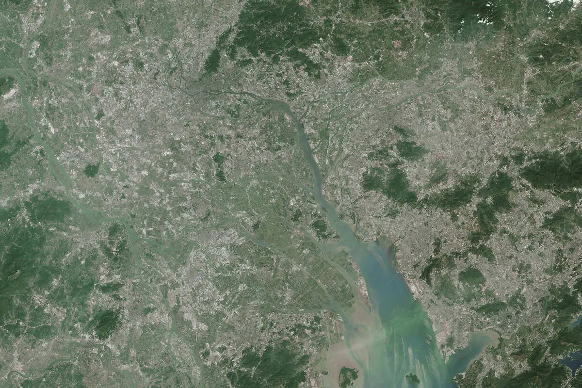 Satellite image of the Pearl River Delta in Guangdong, showing the web of waterways and the estuary where the West River meets the South China Sea