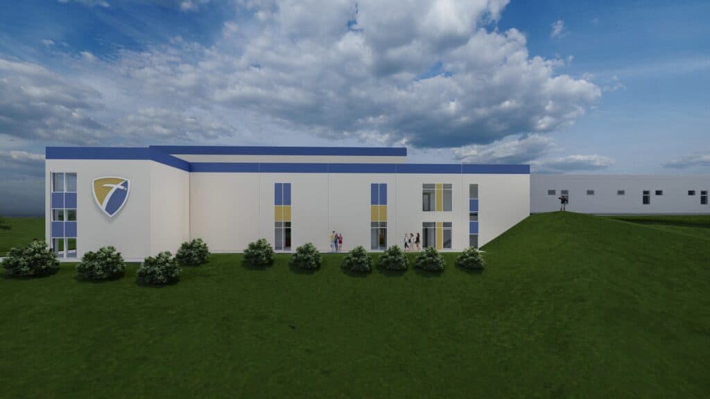 Modern engineering building with ROV Consulting logo and green lawn.