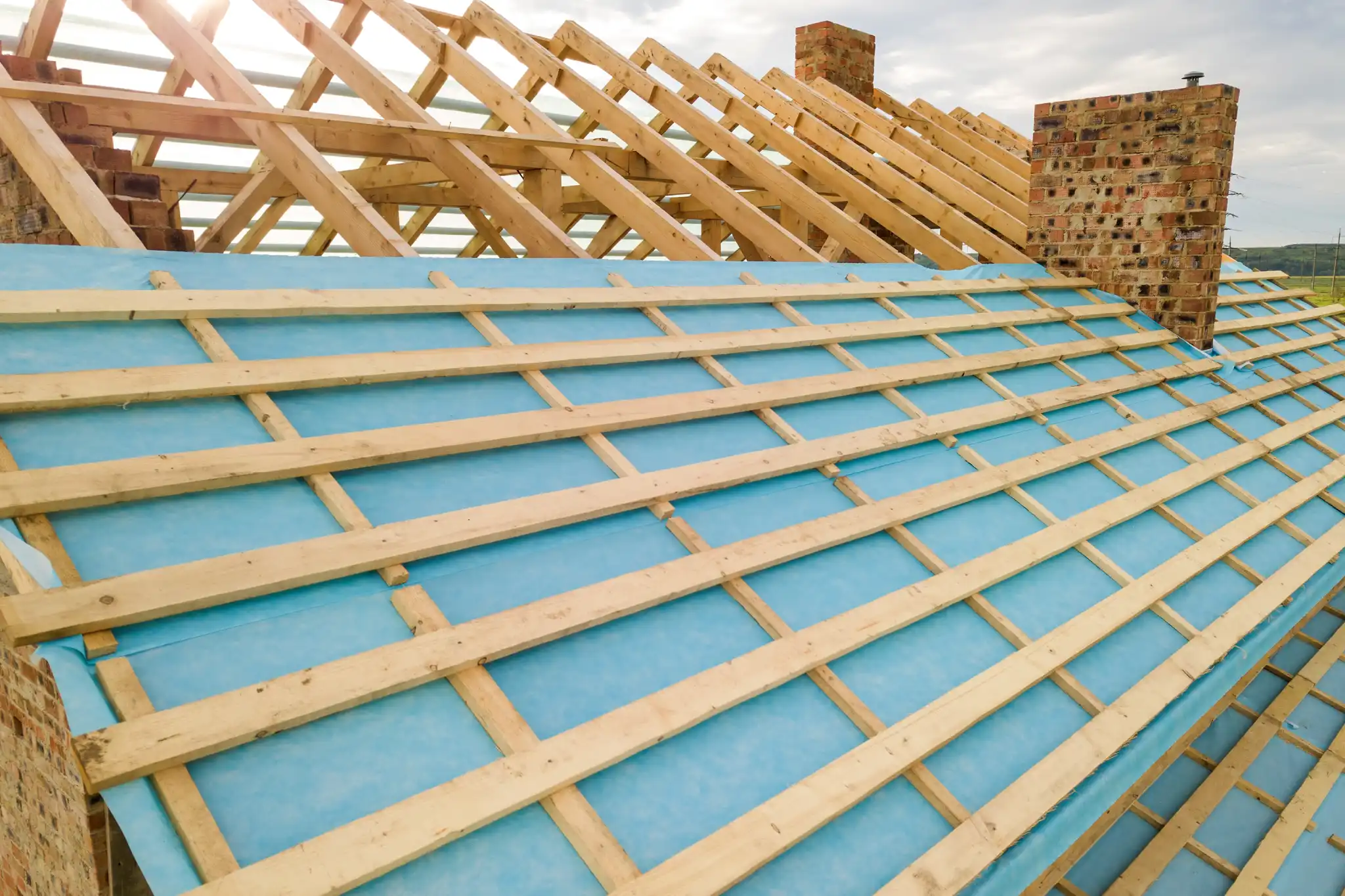 Aerial View Of A Brick House With Wooden Roof Fram 2026 01 06 09 58 28 Utc