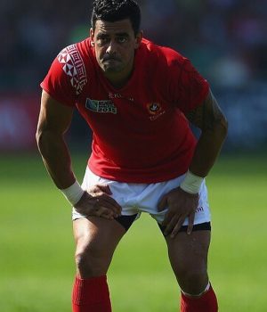 Dynamic rugby player in action during a match, showcasing athleticism and skill.