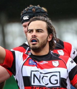 Rugby player celebrating during match, rugby hits media coverage.