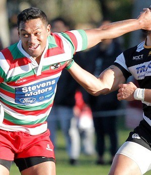 Dynamic rugby player in action during a match, showcasing agility and strength.