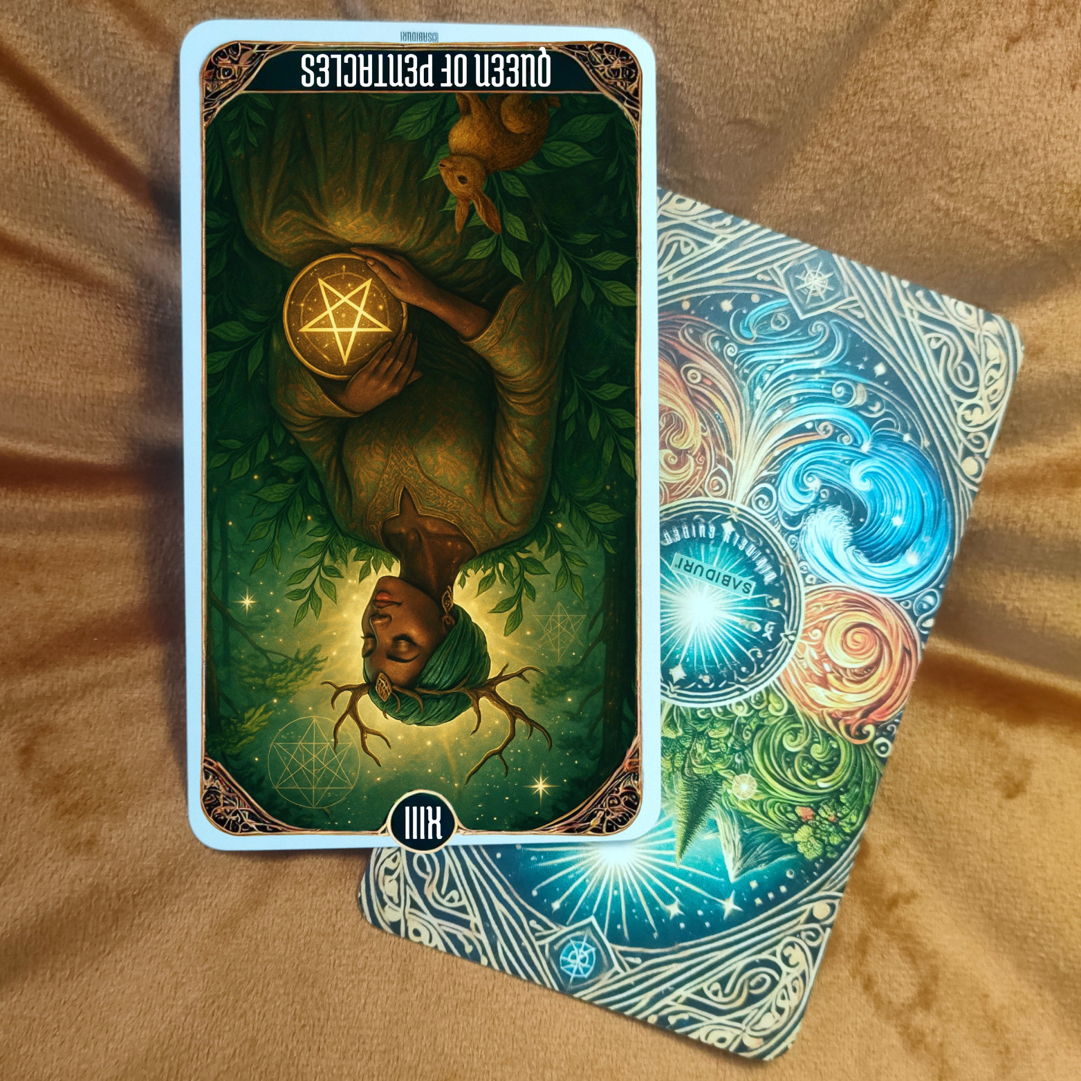 Queen of Pentacles tarot card upside down on a soft brown surface, showing a seated woman holding a golden pentacle. Surrounded by lush green foliage, the rabbit at her feet symbolizes fertility and divine timing. This card represents the Queen of Pentacles tarot card meaning, emphasizing grounding, nurturing, and manifestation.