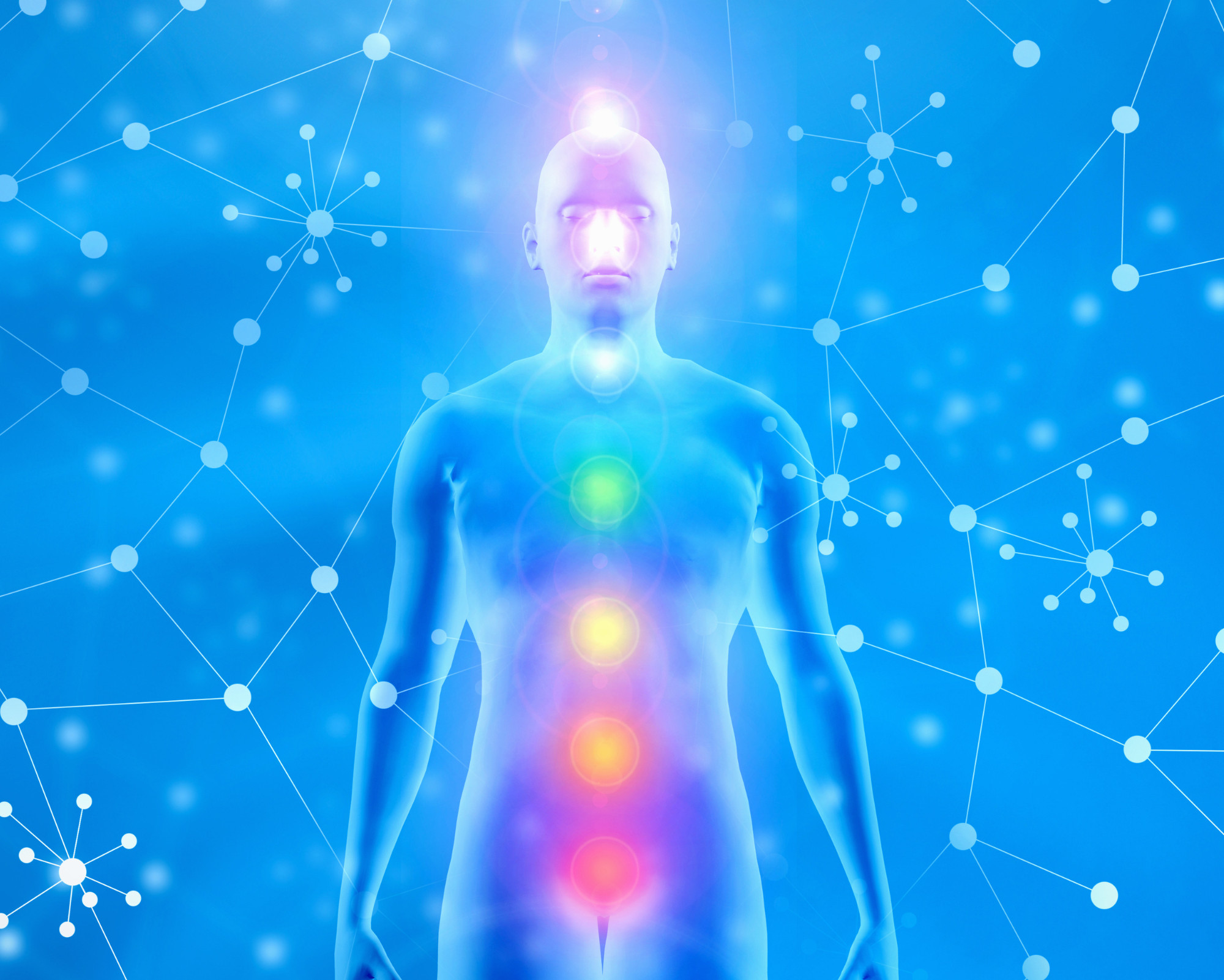 12th Chakra (Stellar Gateway Chakra): All You Need to Know! A glowing human silhouette with the seven chakras illuminated along the spine against a blue energetic background, showing the full chakra system.
