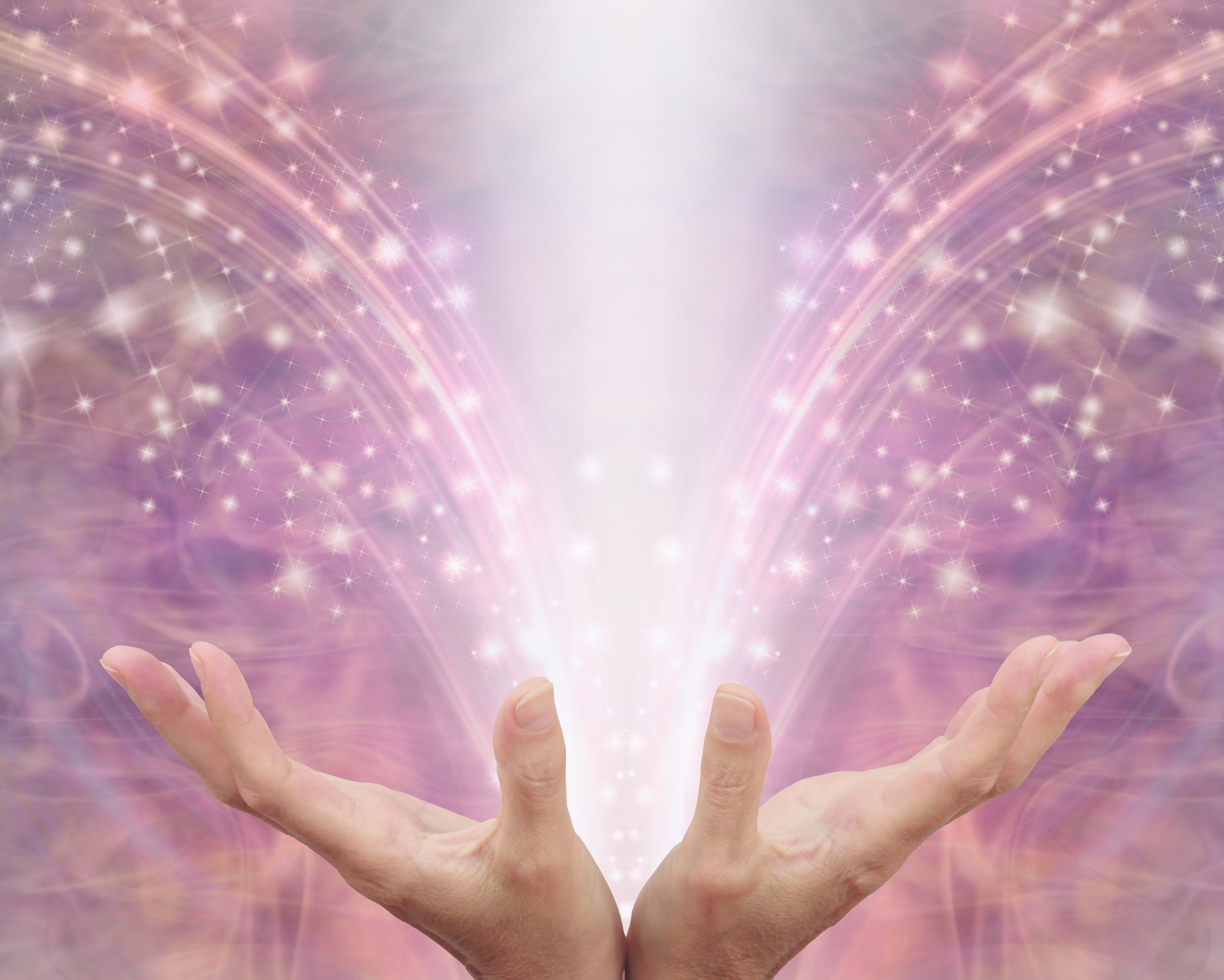 12th Chakra (Stellar Gateway Chakra): All You Need to Know! Hands open toward the sky as streams of pink and white light flow upward, symbolizing spiritual energy, divine connection, and chakra activation.