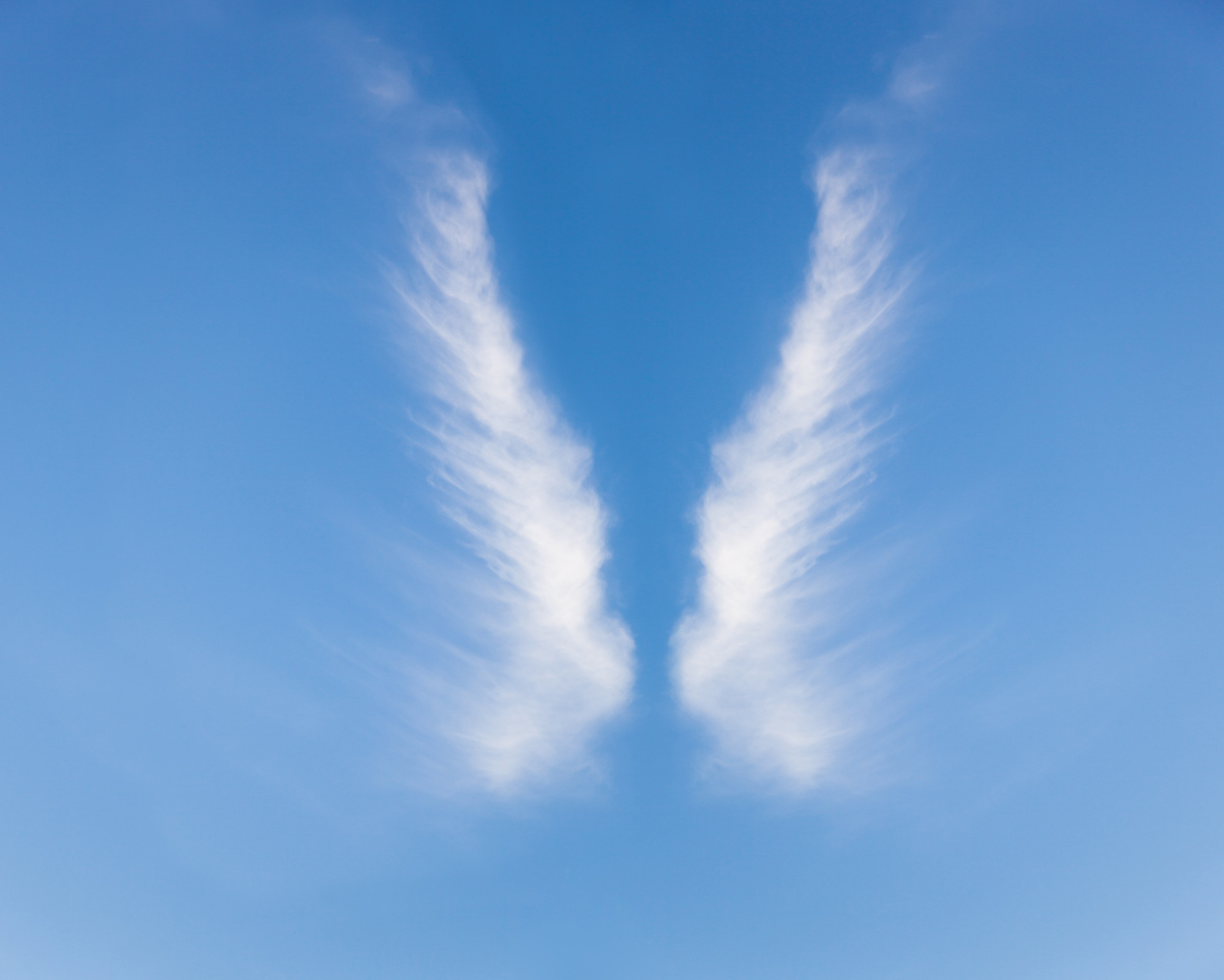 Soft cloud formation resembling angel wings in the sky, representing the presence and message of the 010 angel number.