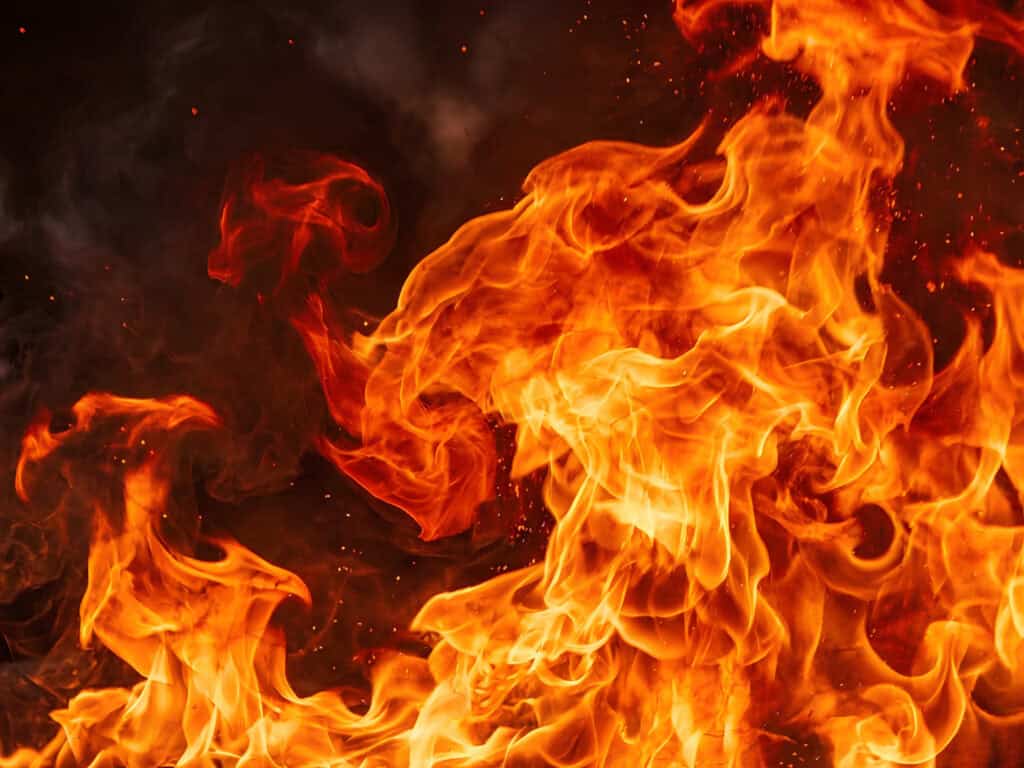 Bright flames representing the fire element, symbolizing transformation and spiritual awakening.