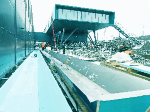 1. Heavy machinery and construction debris at a site, showcasing industrial safety barriers and equipment used by Safeguard Systems Group in China.