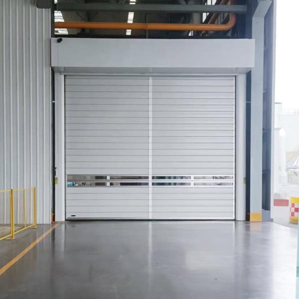 High-speed industrial roll-up door installed in a modern warehouse for enhanced security and efficiency. Durable and reliable solution for industrial access control.