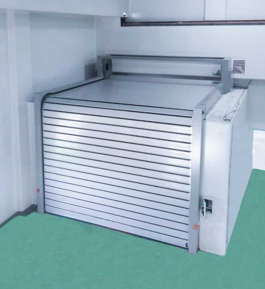 Heavy-duty industrial roll-up security door designed for high-security environments, made from durable metal with horizontal slats, ideal for commercial and industrial facilities.