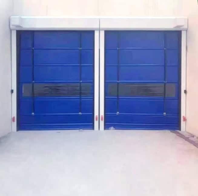 Automatic sectional overhead doors with blue panels, designed for industrial and commercial security and easy operation.