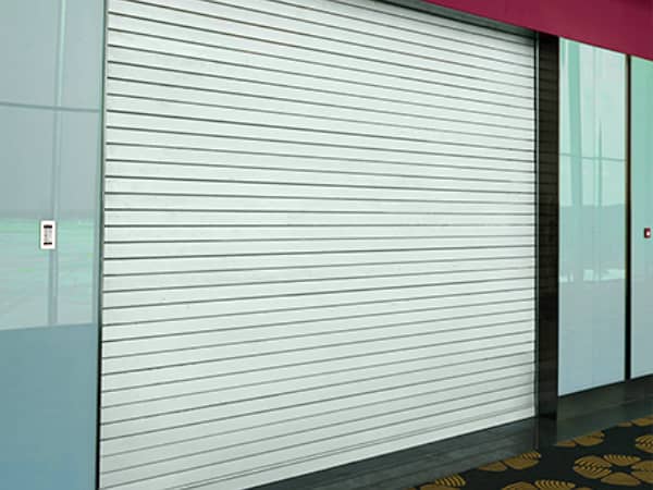 1. High-quality white security rolling door suitable for commercial and industrial use, featuring durable construction and smooth operation.