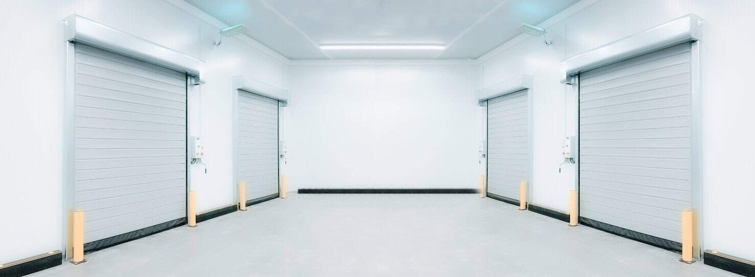 High-speed industrial roll-up doors in a clean, modern warehouse environment for secure storage and efficient access.