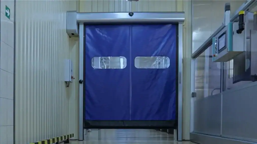 High speed cleanroom rapid door installed in GMP facility for hygienic material transfer and controlled airflow