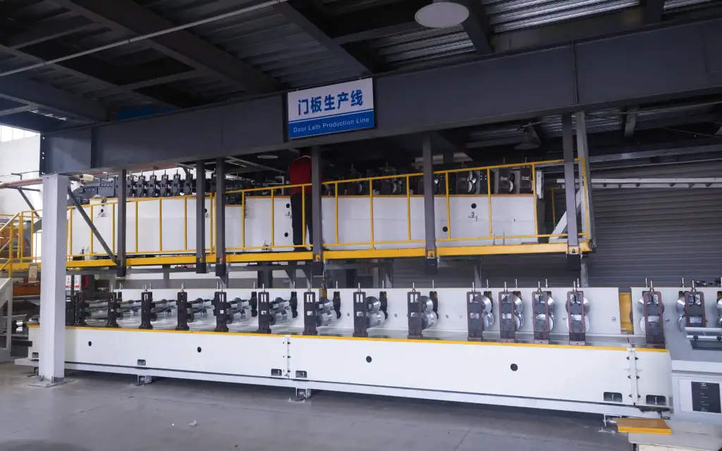 High-speed spiral door rigid slat production line at a HONMEN Group manufacturing facility