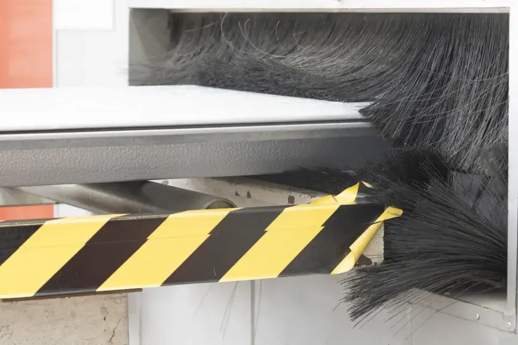 Production machine processing an industrial door panel