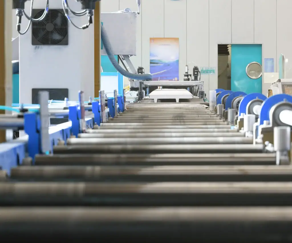 Production line manufacturing sectional panels for industrial and garage doors at a HONMEN Group facility