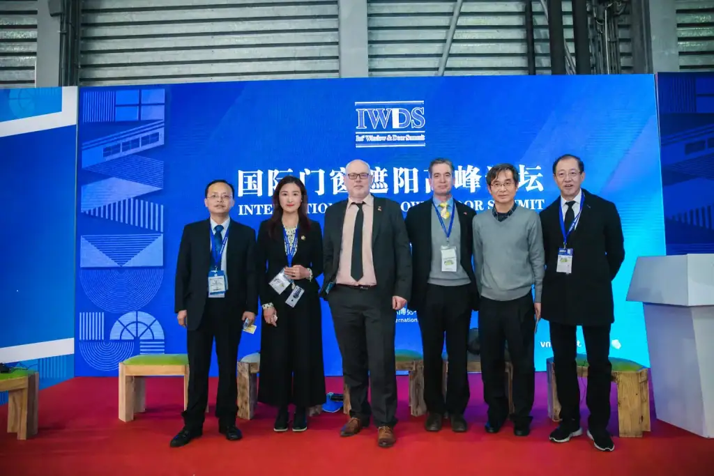 Safeguard Door representatives with international window and door industry participants at a summit