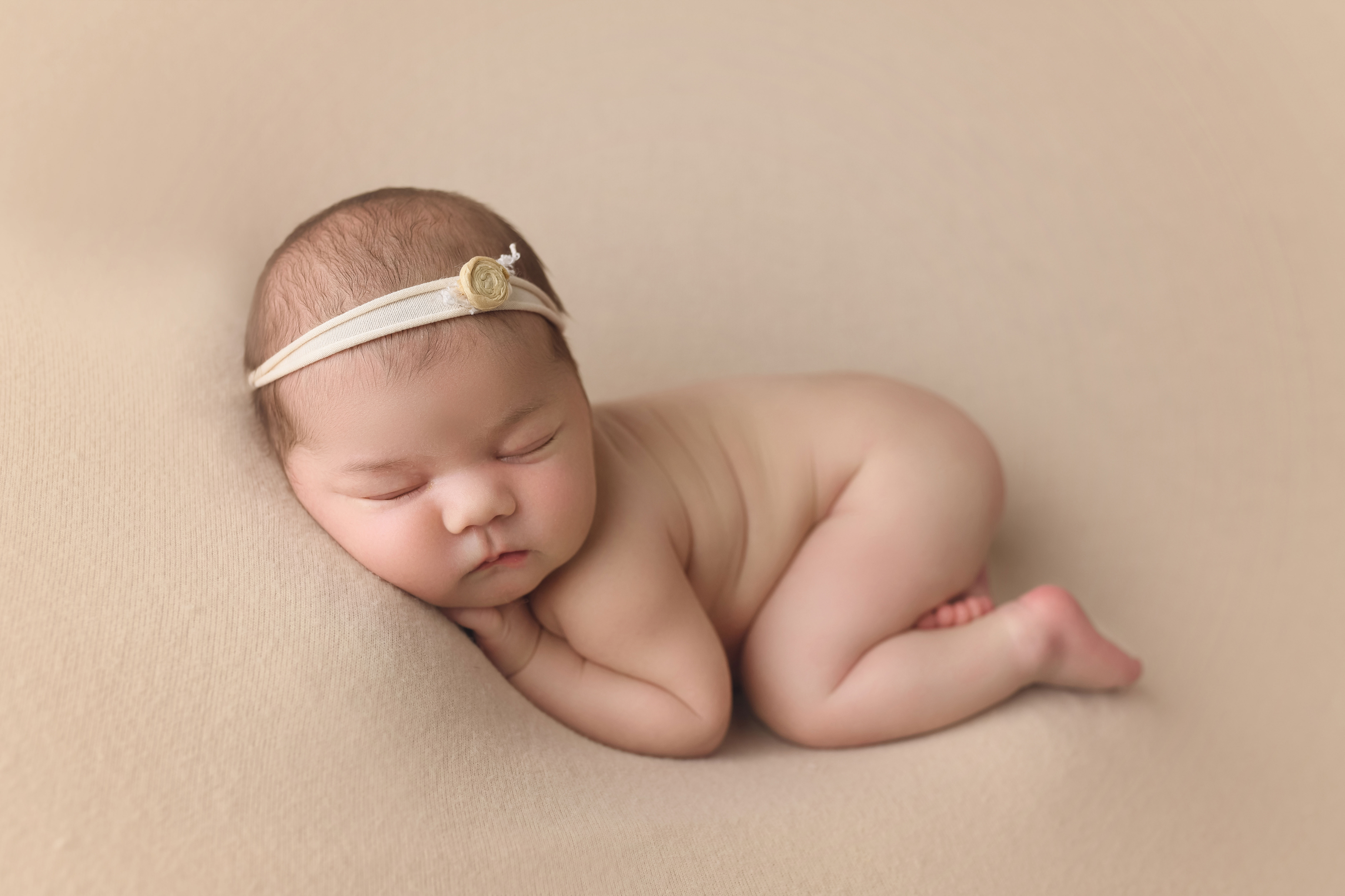newborn baby girl bum up