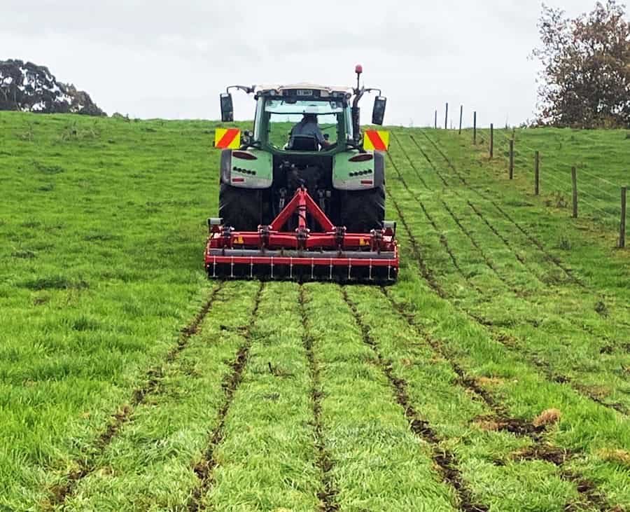 Machinery working on lush green farmland, sustainable agriculture in action.