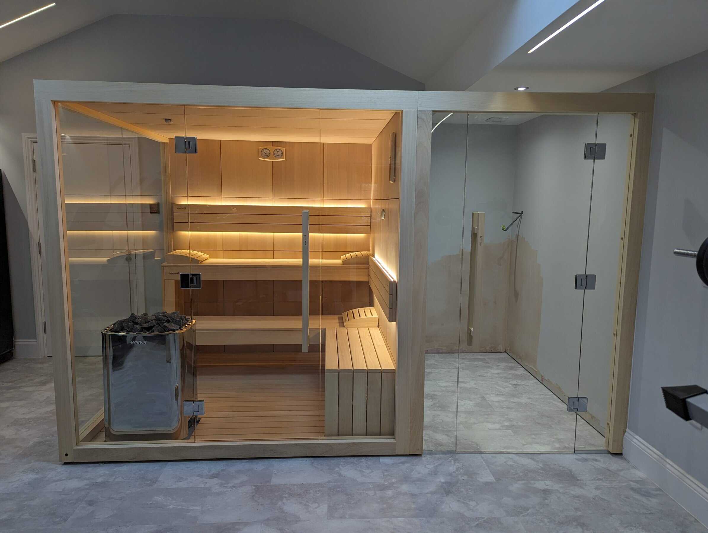 Relaxing indoor sauna with glass door and wooden interior, ideal for home wellness and relaxation. Perfect for creating a spa-like atmosphere in your private space.