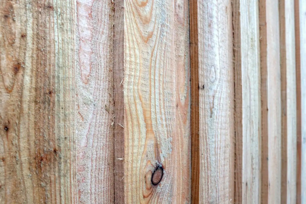 Detail shot of Scottish larch board on board cladding on wall