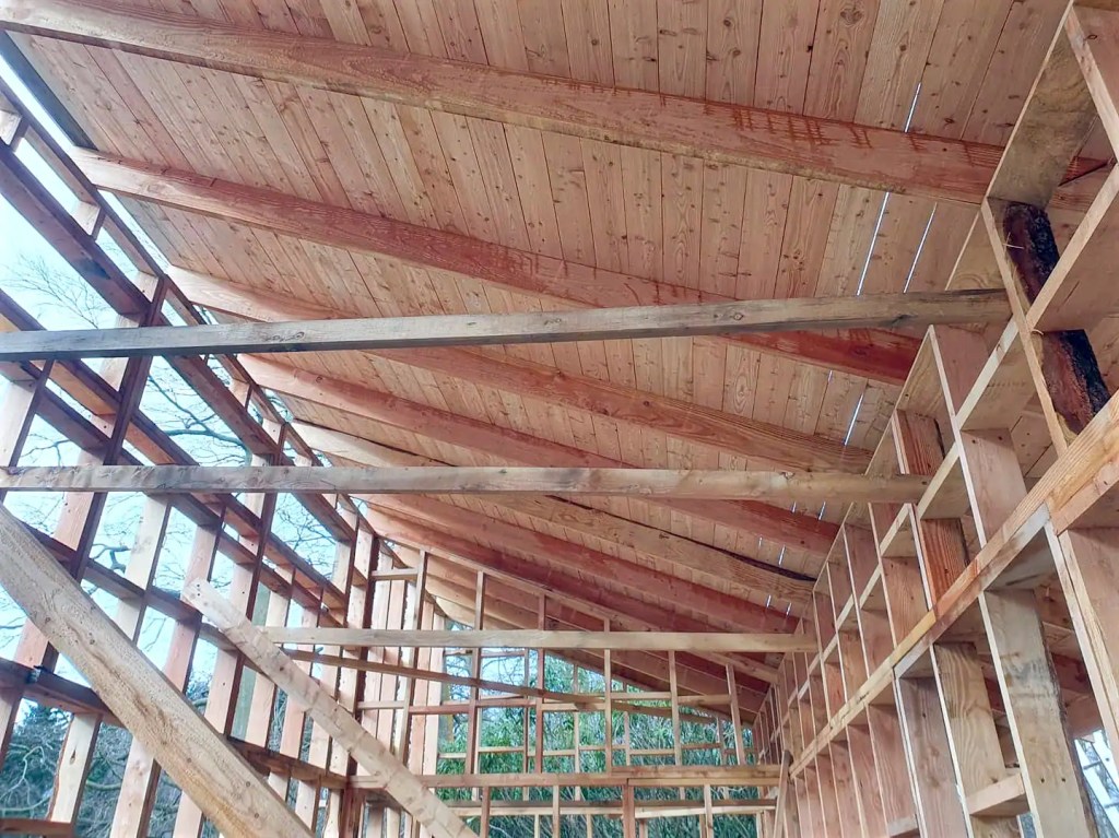 Larch timber framing, a half framed out building using Scottish larch