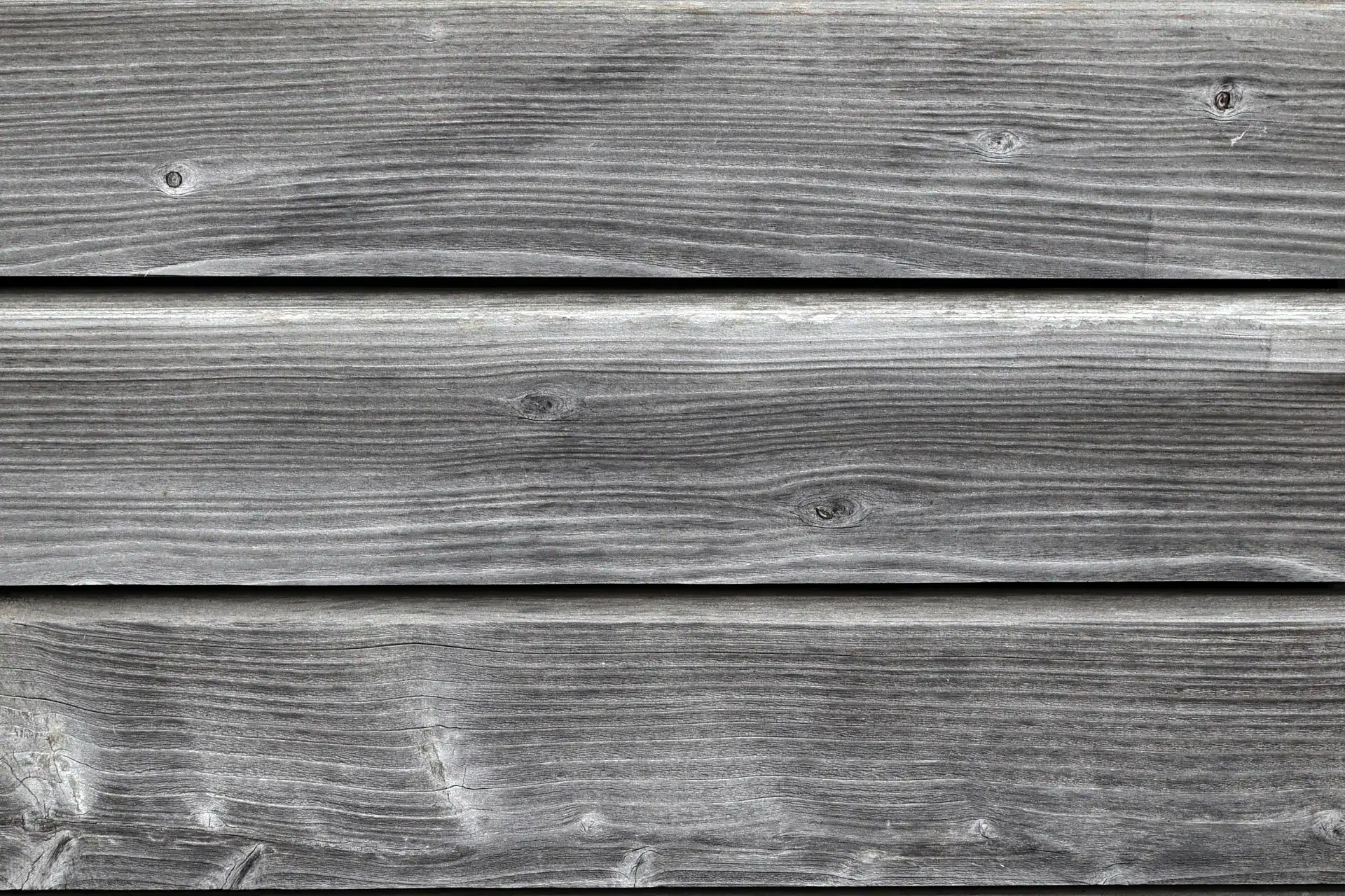 Weathered cladding with deep silver colour