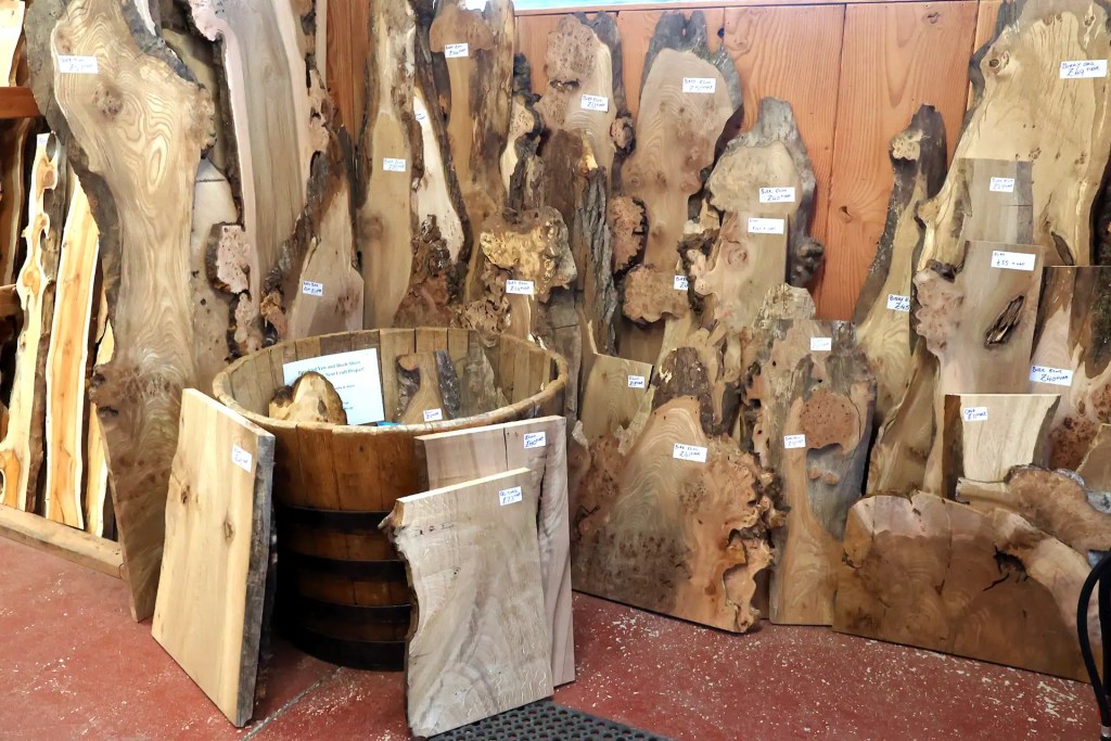 Display of naturally shaped burrs and boards at Scottish Wood timber shop