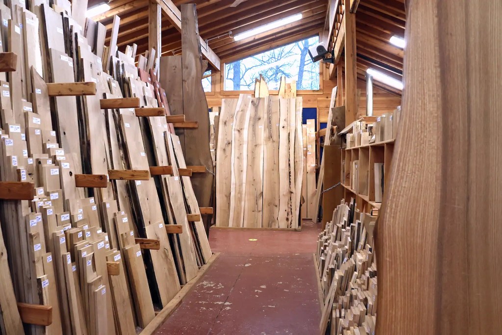A timber shop with large windows and beautiful hardwood timber boards and offcuts