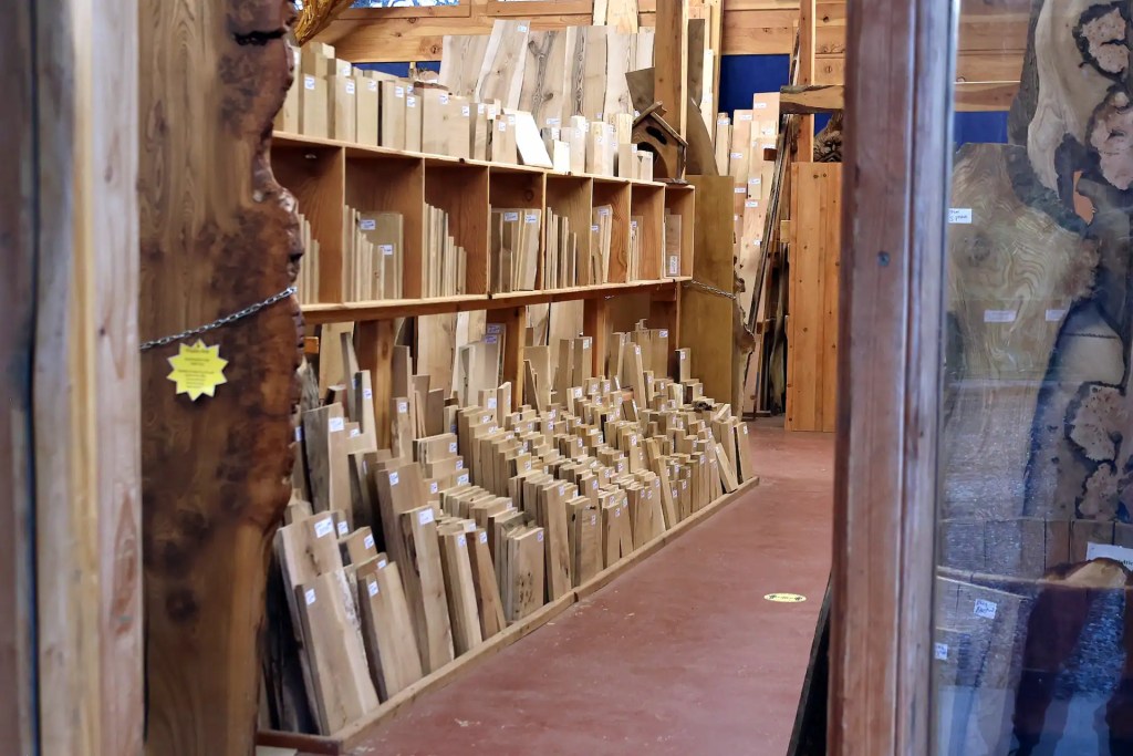 A timber shop with shelves full of hardwood offcuts in a variety of sizes